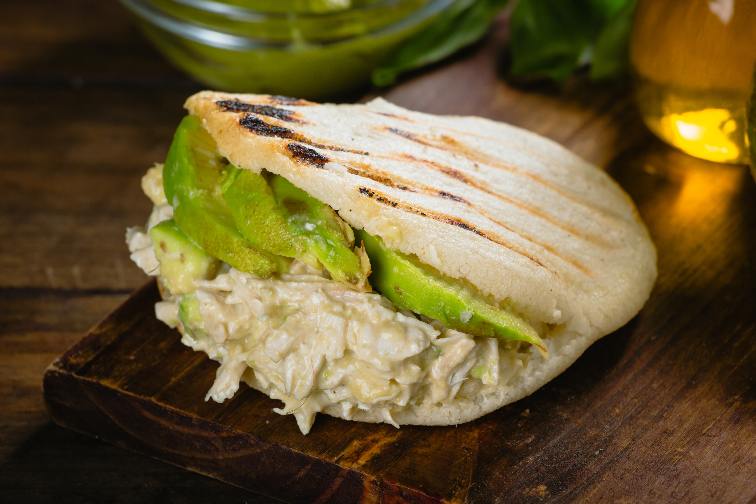 Arepa, with chiken and avocado, this conination is refered as a Reina Pepeada