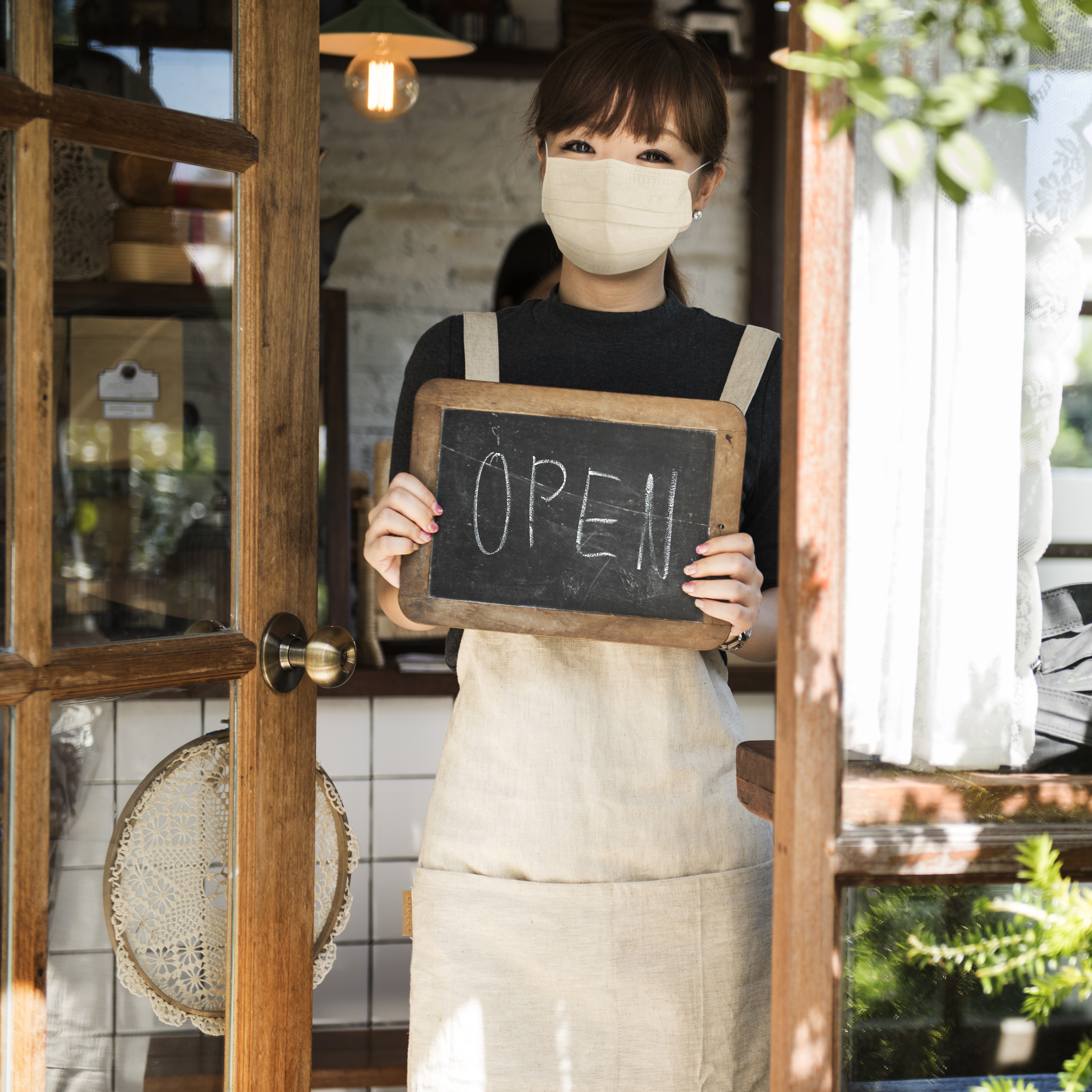 e are Open sign with staff member